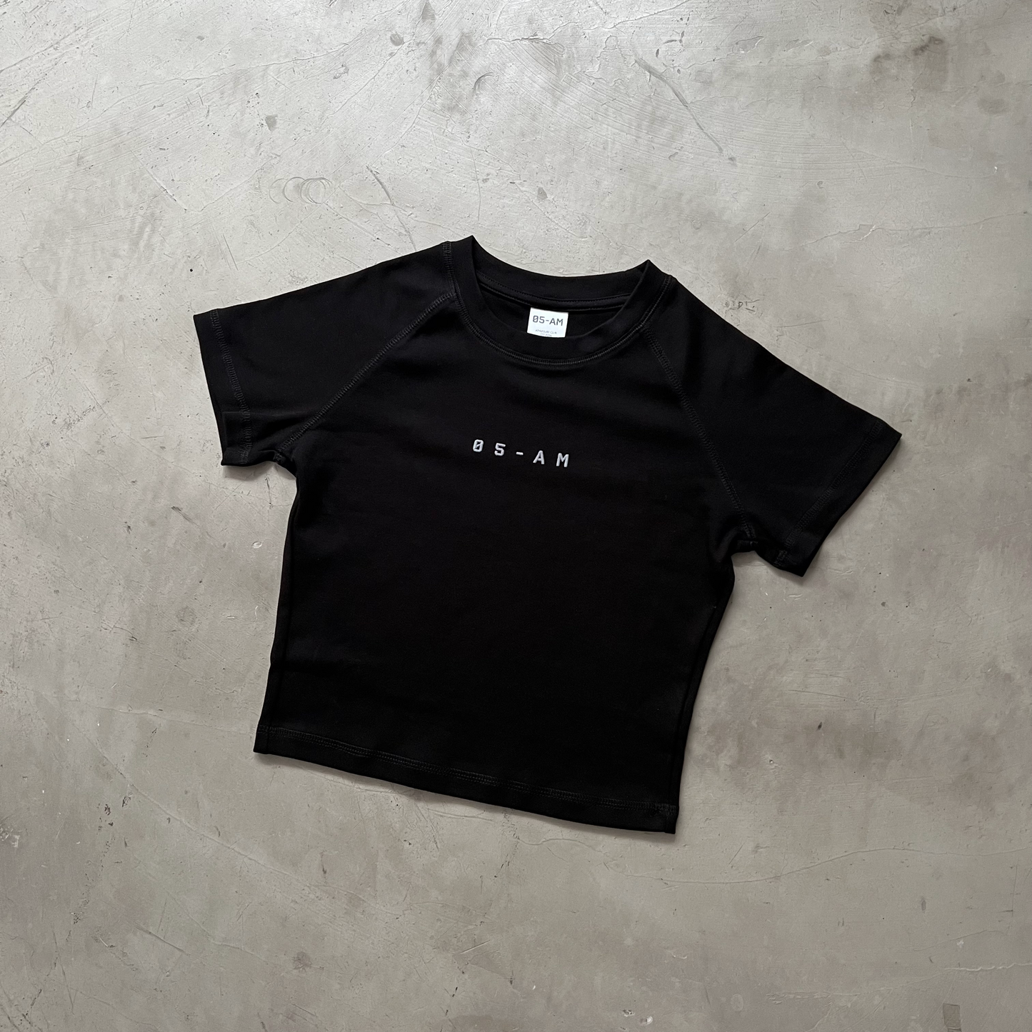 05-AM Jet Black Raglan Baby Tee