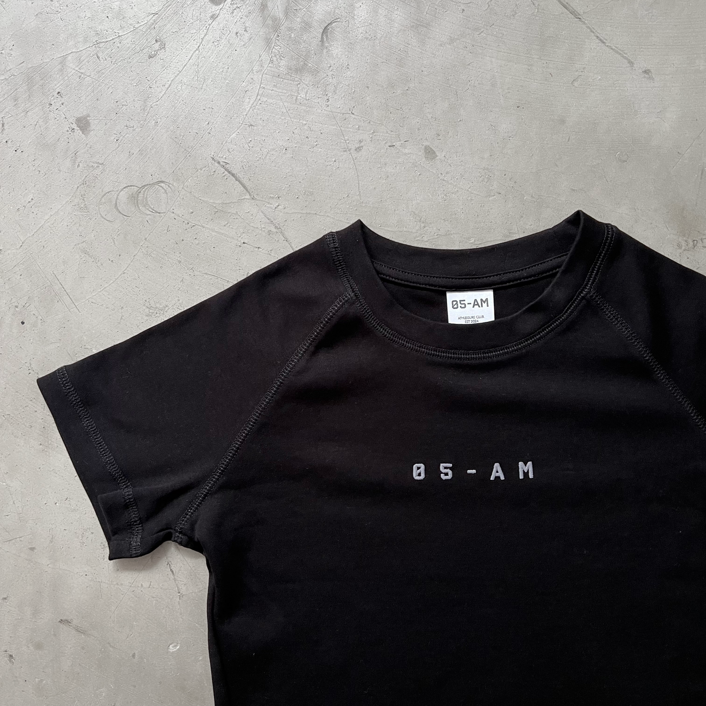 05-AM Jet Black Raglan Baby Tee